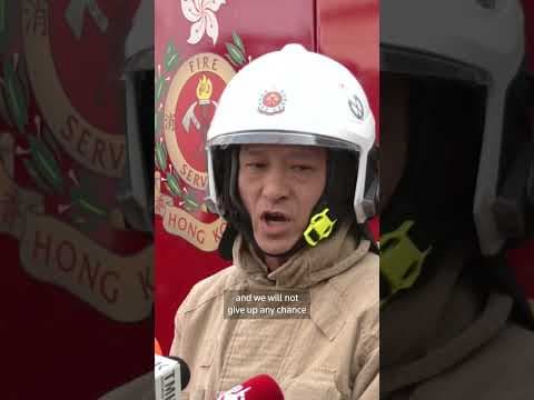 Hong Kong firefighters battle apartment blaze amid great danger