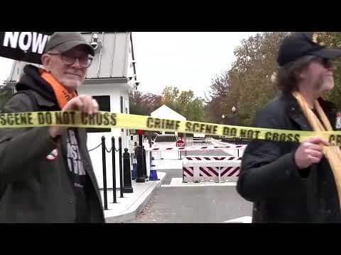 Protesters wrap 'crime scene' tape around White House perimeter | REUTERS